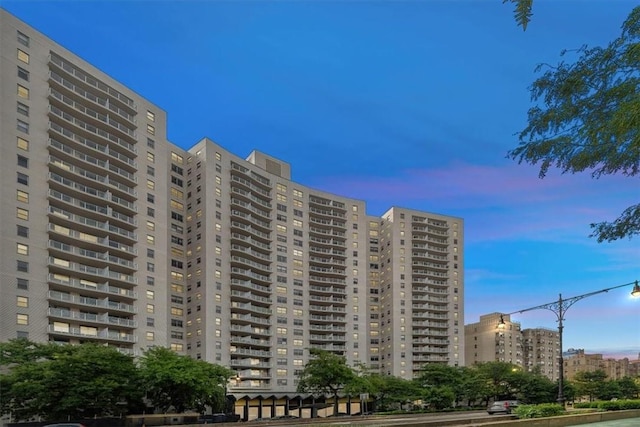 view of outdoor building at dusk