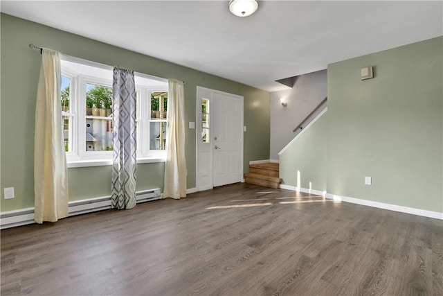 foyer featuring hardwood / wood-style floors and baseboard heating