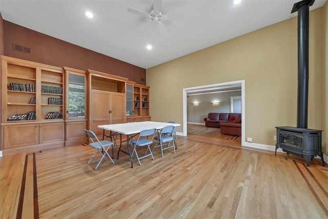 dining space featuring light wood-type flooring and ceiling fan