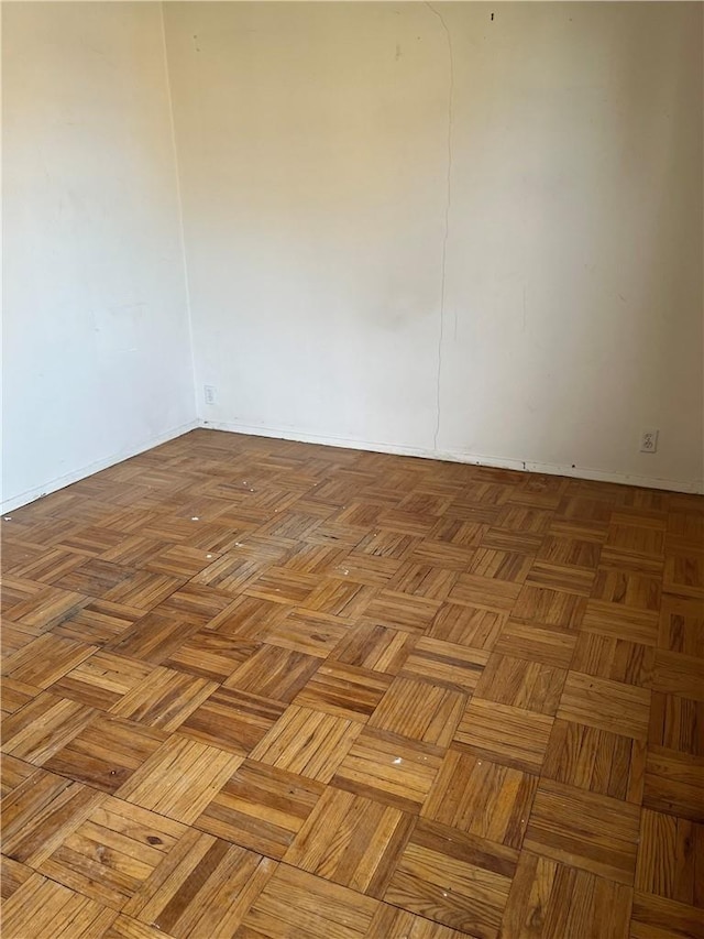 empty room with light parquet flooring