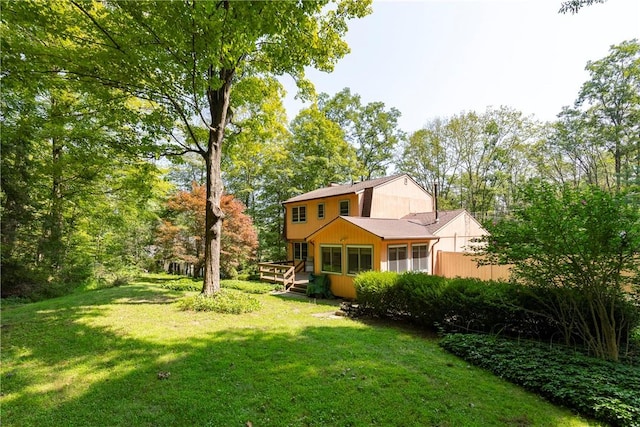 view of yard featuring a wooden deck