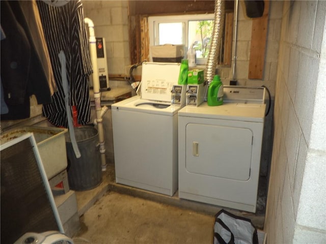 laundry area with independent washer and dryer