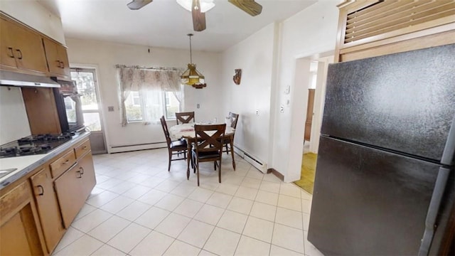 kitchen featuring black appliances, ceiling fan, baseboard heating, and hanging light fixtures