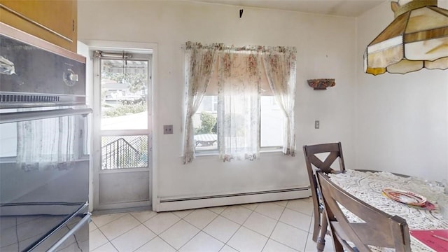 interior space featuring baseboard heating and light tile patterned floors