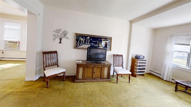 sitting room with baseboard heating, carpet, and cooling unit