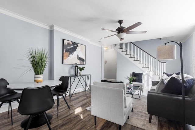 living room featuring ceiling fan, wood-type flooring, and ornamental molding