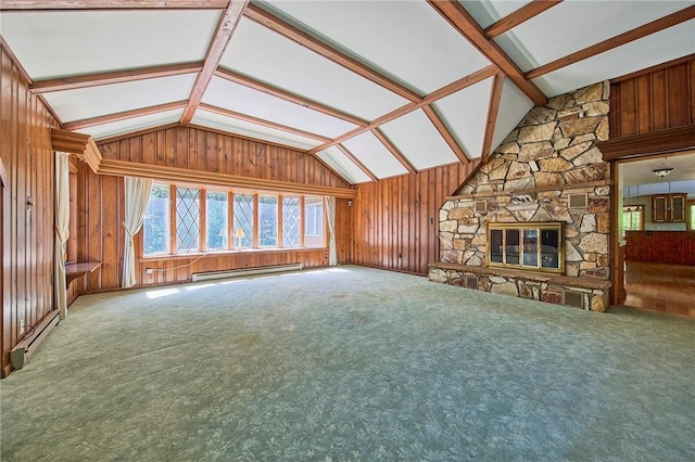 432 Black Forest Rd, Glen Spey, NY 12737 - unfurnished living room with lofted ceiling, baseboard heating, wood walls, carpet flooring, and a stone fireplace
