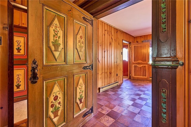432 Black Forest Rd, Glen Spey, NY 12737 - hall featuring a baseboard heating unit, tile patterned floors, and wood walls