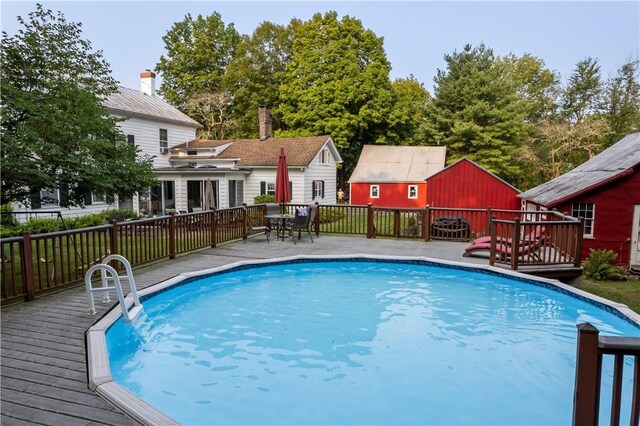 view of pool featuring a wooden deck