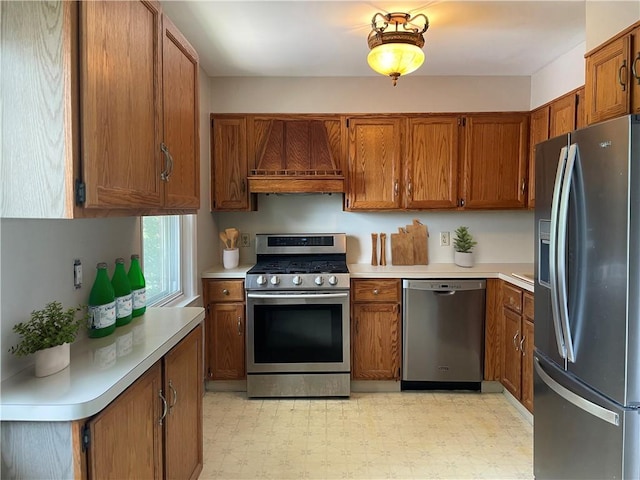 kitchen with premium range hood and appliances with stainless steel finishes