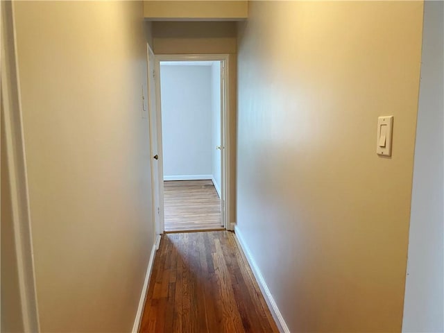 hallway featuring dark wood-type flooring