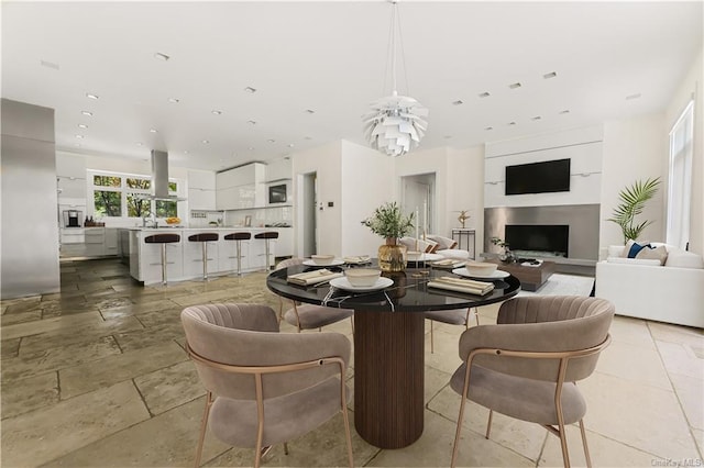 dining space with an inviting chandelier