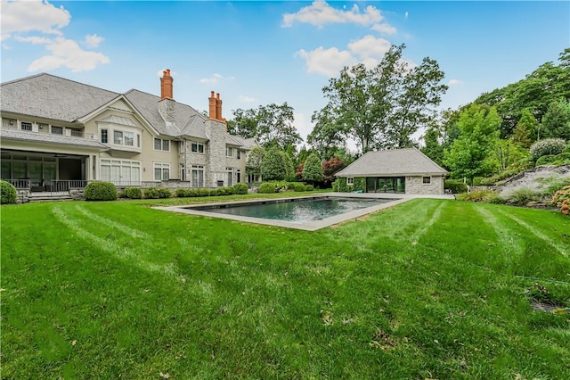 view of pool featuring a lawn