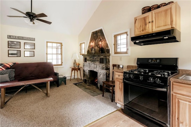 kitchen featuring a healthy amount of sunlight, black range with gas stovetop, and light brown cabinets