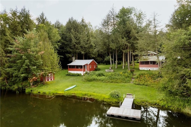 dock area featuring a yard and a water view