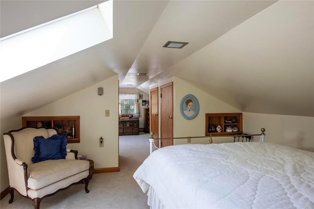 bedroom featuring light colored carpet and vaulted ceiling