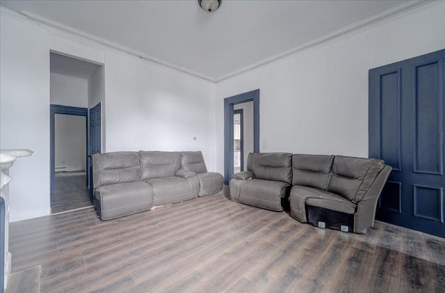 living room with crown molding and hardwood / wood-style floors