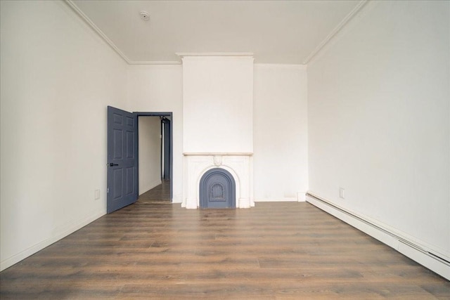 unfurnished living room with ornamental molding, dark wood-type flooring, and a baseboard heating unit