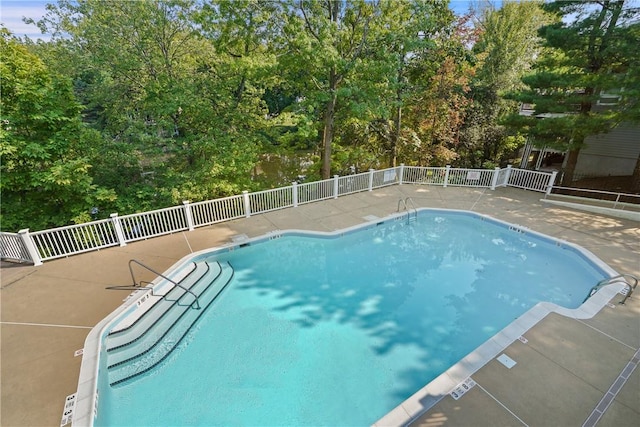 view of swimming pool featuring a patio