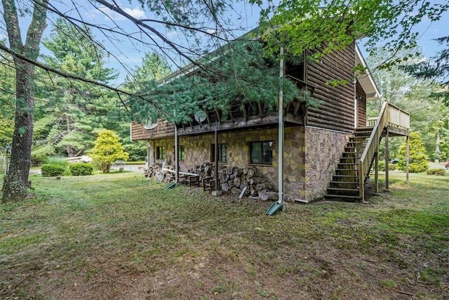 view of property exterior featuring a lawn