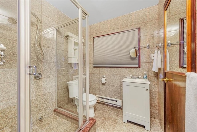 bathroom with a baseboard heating unit, sink, tile walls, toilet, and a shower with shower door