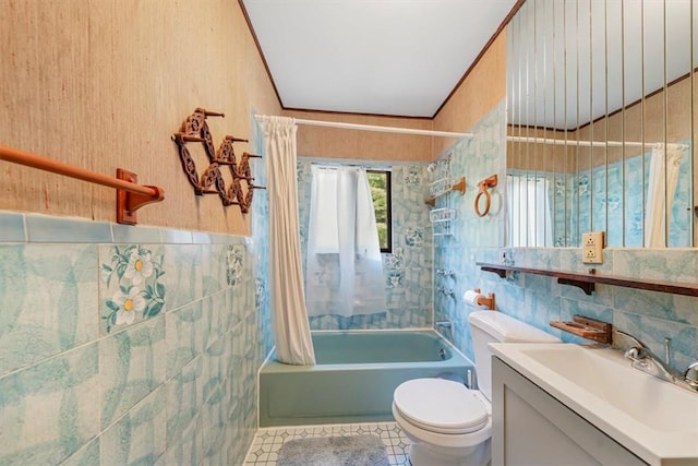 full bathroom featuring shower / bathtub combination with curtain, tile patterned floors, toilet, vanity, and tile walls