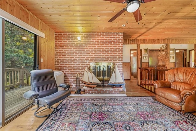 interior space featuring wood walls, hardwood / wood-style floors, wood ceiling, and brick wall