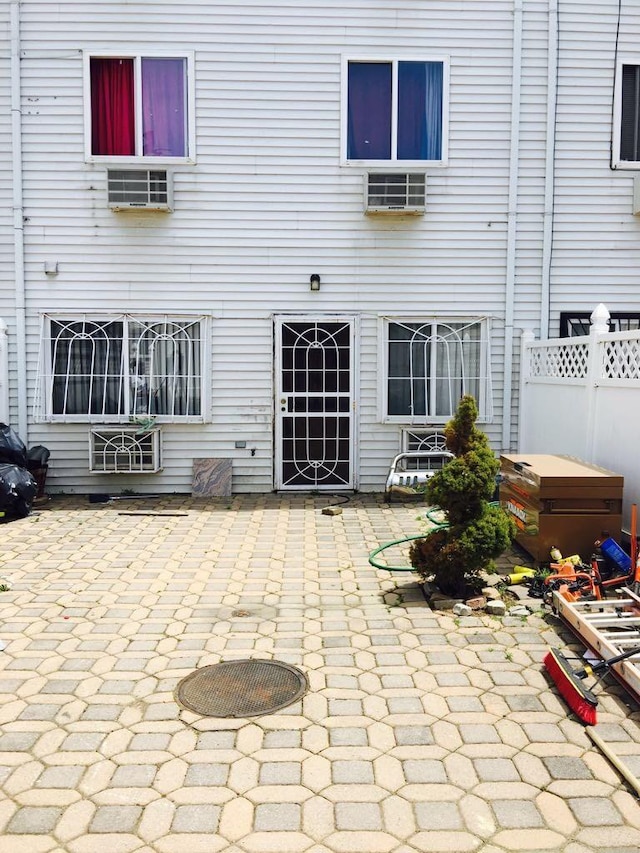 rear view of property featuring a patio area