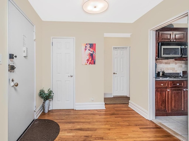 hallway featuring light wood-type flooring