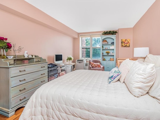 bedroom with light hardwood / wood-style floors