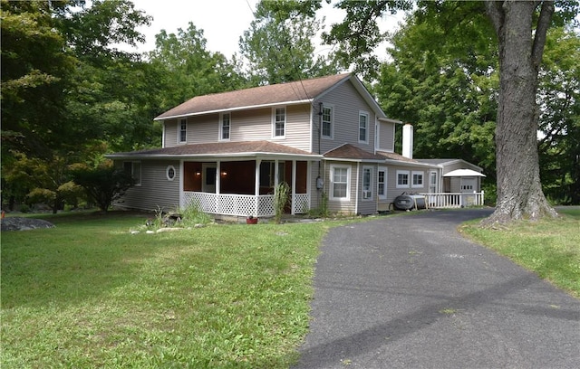 view of front of property with a porch and a front yard