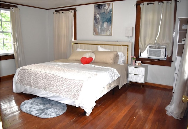 bedroom featuring crown molding, cooling unit, and dark wood-type flooring