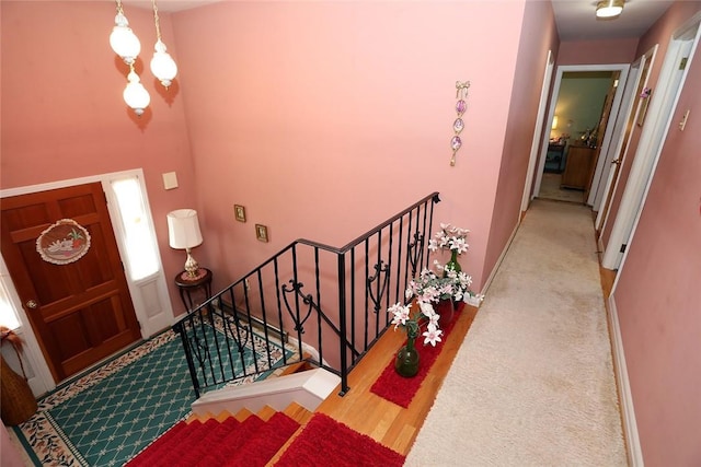 entrance foyer featuring light carpet