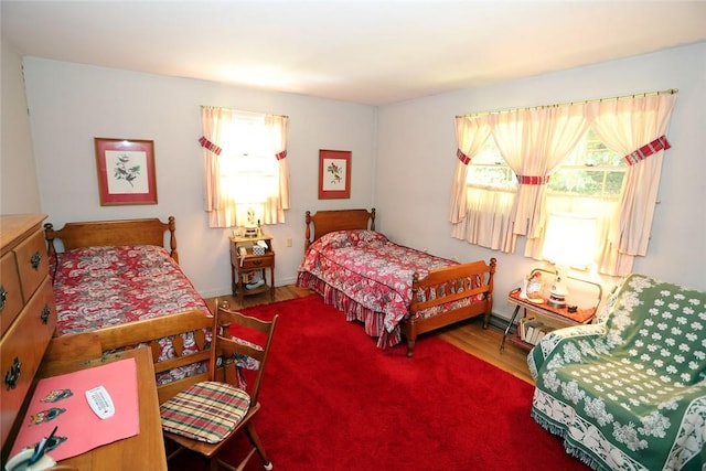 bedroom with hardwood / wood-style flooring