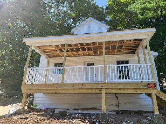 back of property with a deck