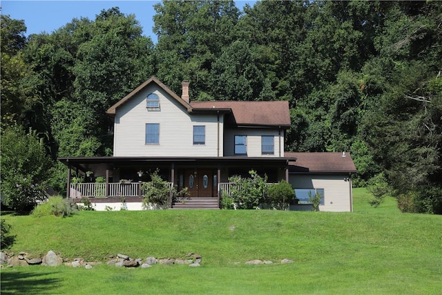 farmhouse with covered porch and a front lawn