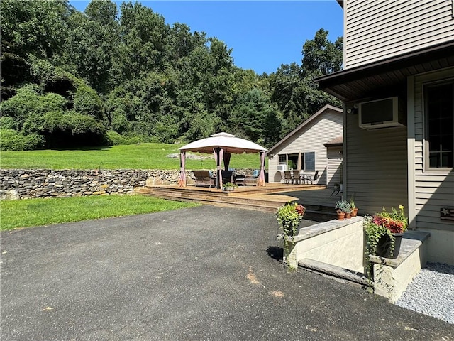 exterior space featuring a gazebo and a deck