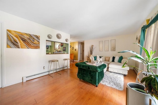 living room featuring hardwood / wood-style floors and baseboard heating