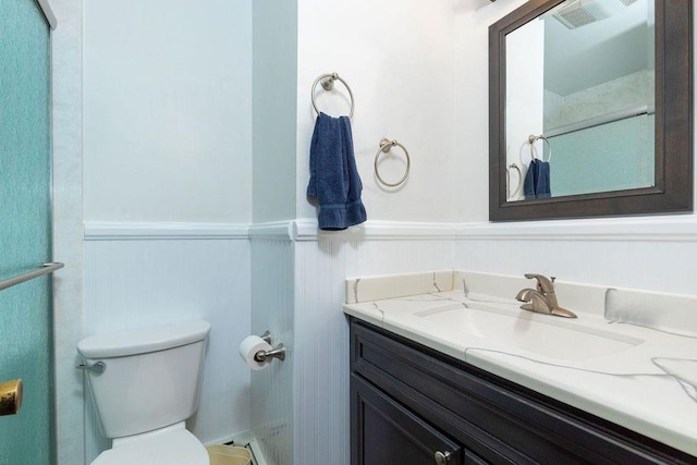 bathroom with vanity and toilet