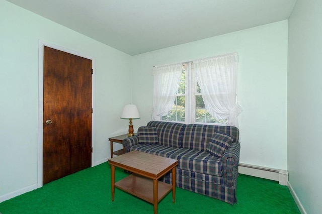 sitting room with carpet and a baseboard heating unit