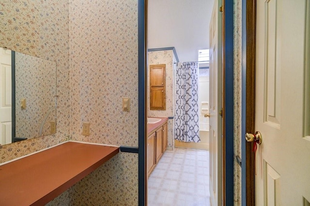 bathroom with shower / bath combination with curtain and vanity