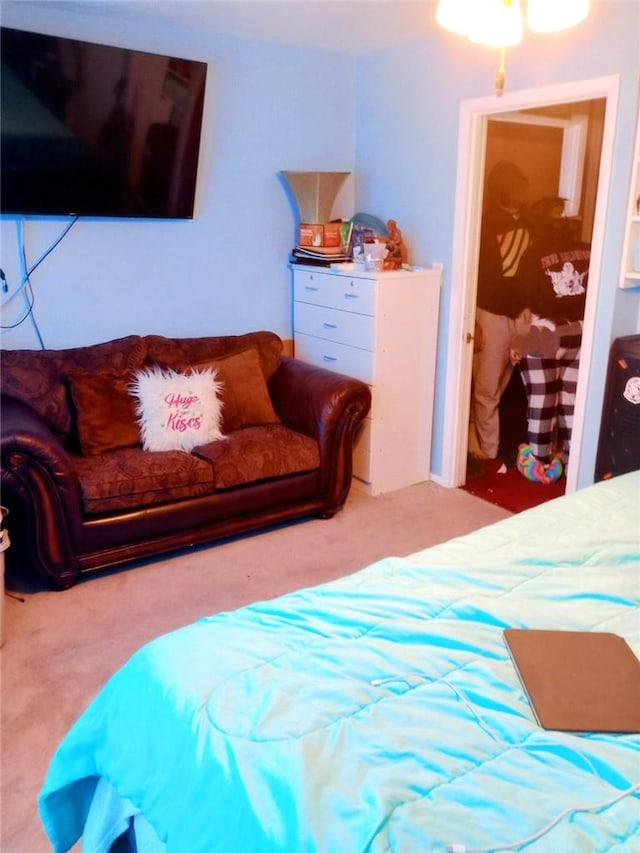 bedroom featuring light colored carpet