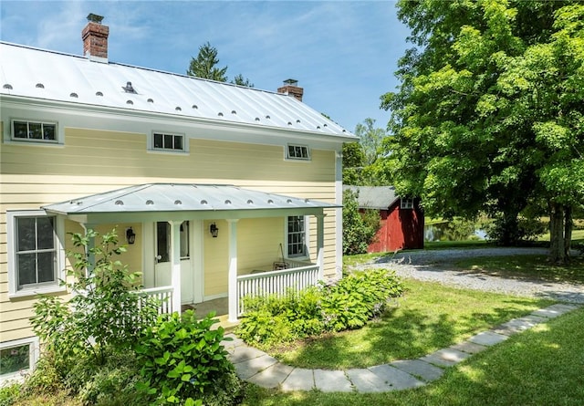 rear view of house with a porch