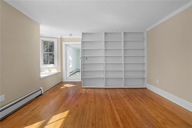 unfurnished room with light hardwood / wood-style floors, ornamental molding, and a baseboard heating unit