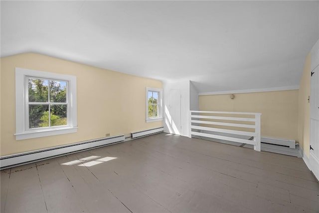 bonus room featuring hardwood / wood-style flooring, vaulted ceiling, and baseboard heating