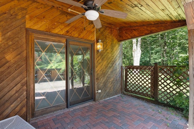 entrance to property featuring ceiling fan