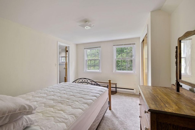 bedroom with light carpet and a baseboard radiator