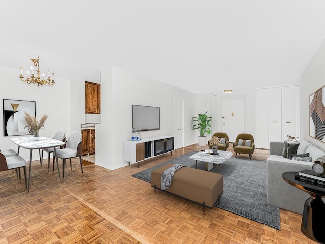 living room featuring parquet floors and a notable chandelier