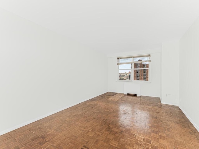 spare room with parquet floors