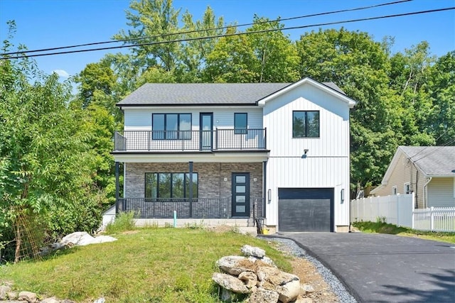 3 Forshee St, Monroe, NY 10950 - view of front of property with a balcony, asphalt driveway, a garage, and a porch